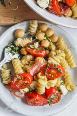 chickpea salad on a plate with a fork