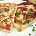 Leftover Mashed Potato Pancakes on a plate garnished with parsley