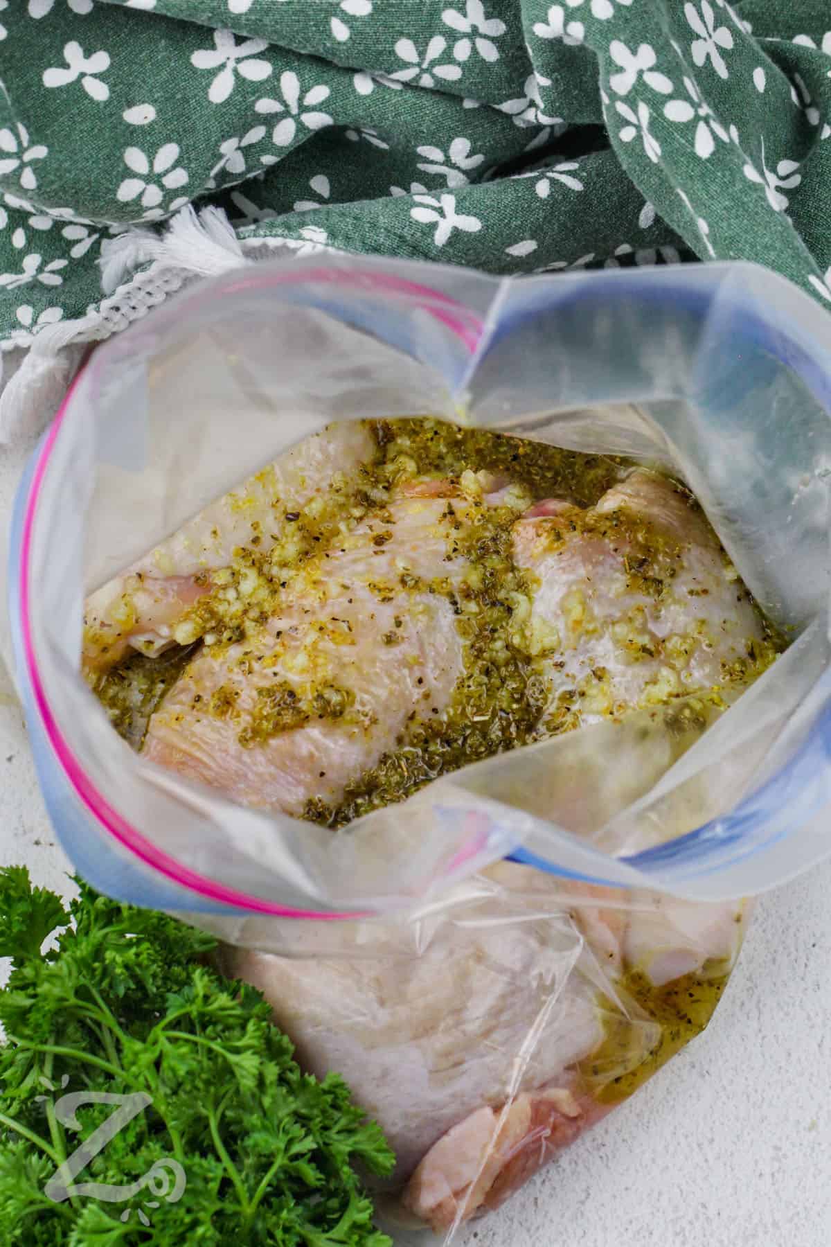chicken thighs in a zippered bag being marinated