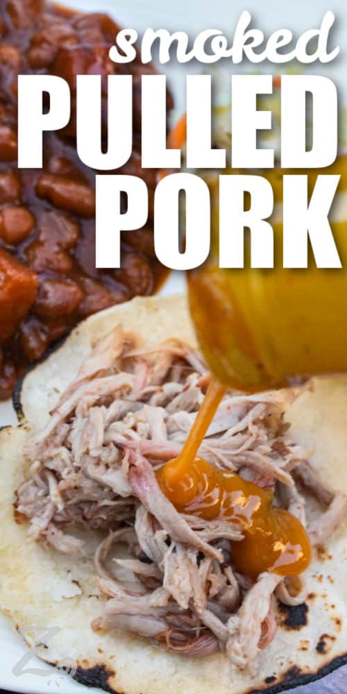 adding sauce to Smoked Pulled Pork on a tortilla with a title