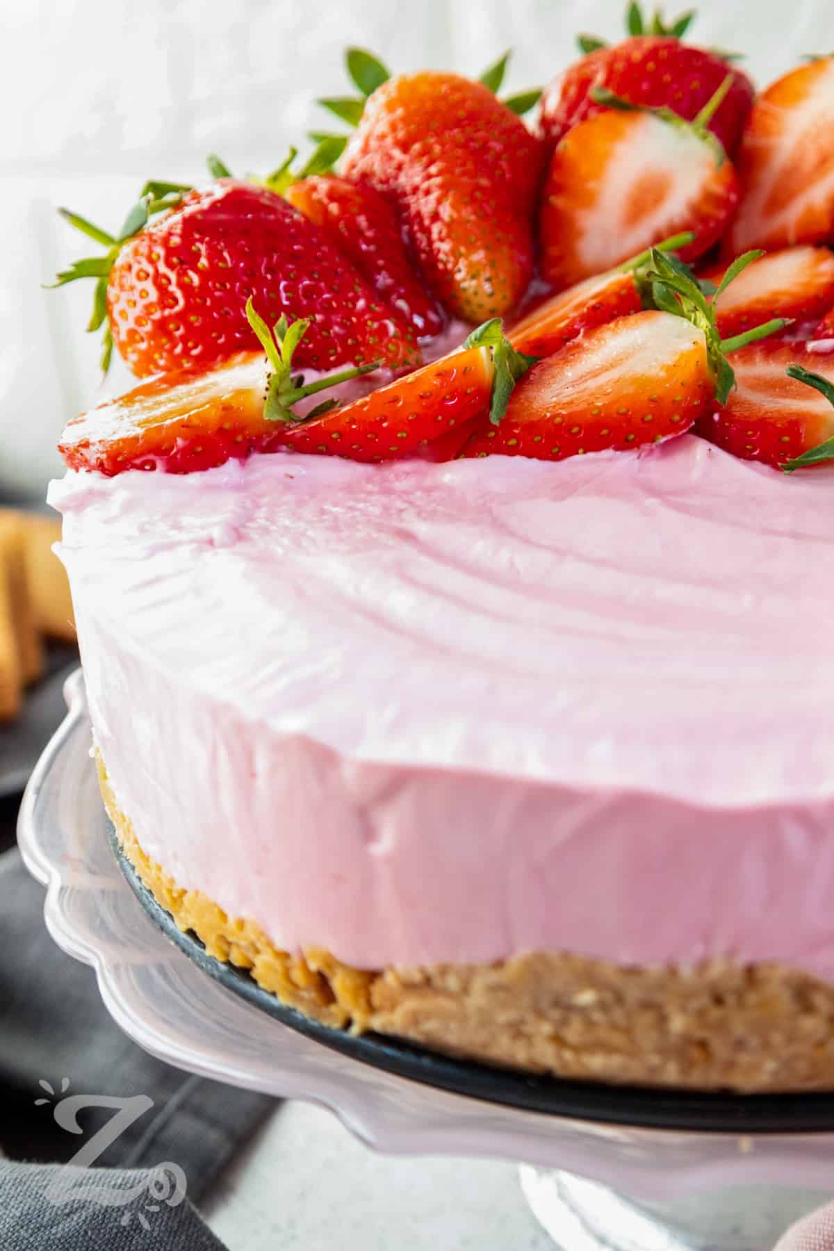 no bake strawberry cheesecake with sliced strawberries on top
