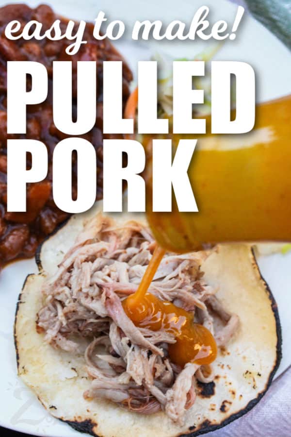 adding sauce to Smoked Pulled Pork with writing