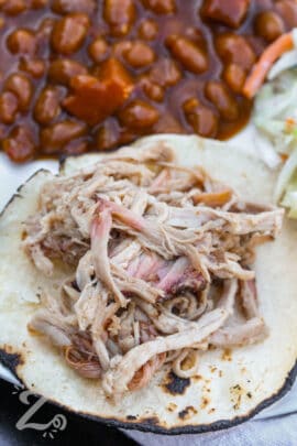 Smoked Pulled Pork on a tortilla with beans