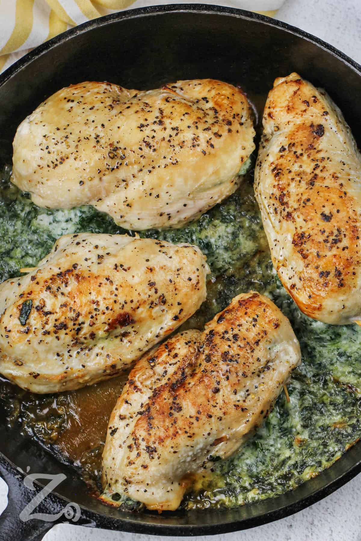 Spinach Stuffed Chicken Breasts preppared in a frying pan