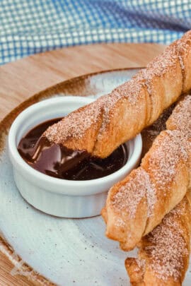 dipped Baked Churros in chocolate sauce