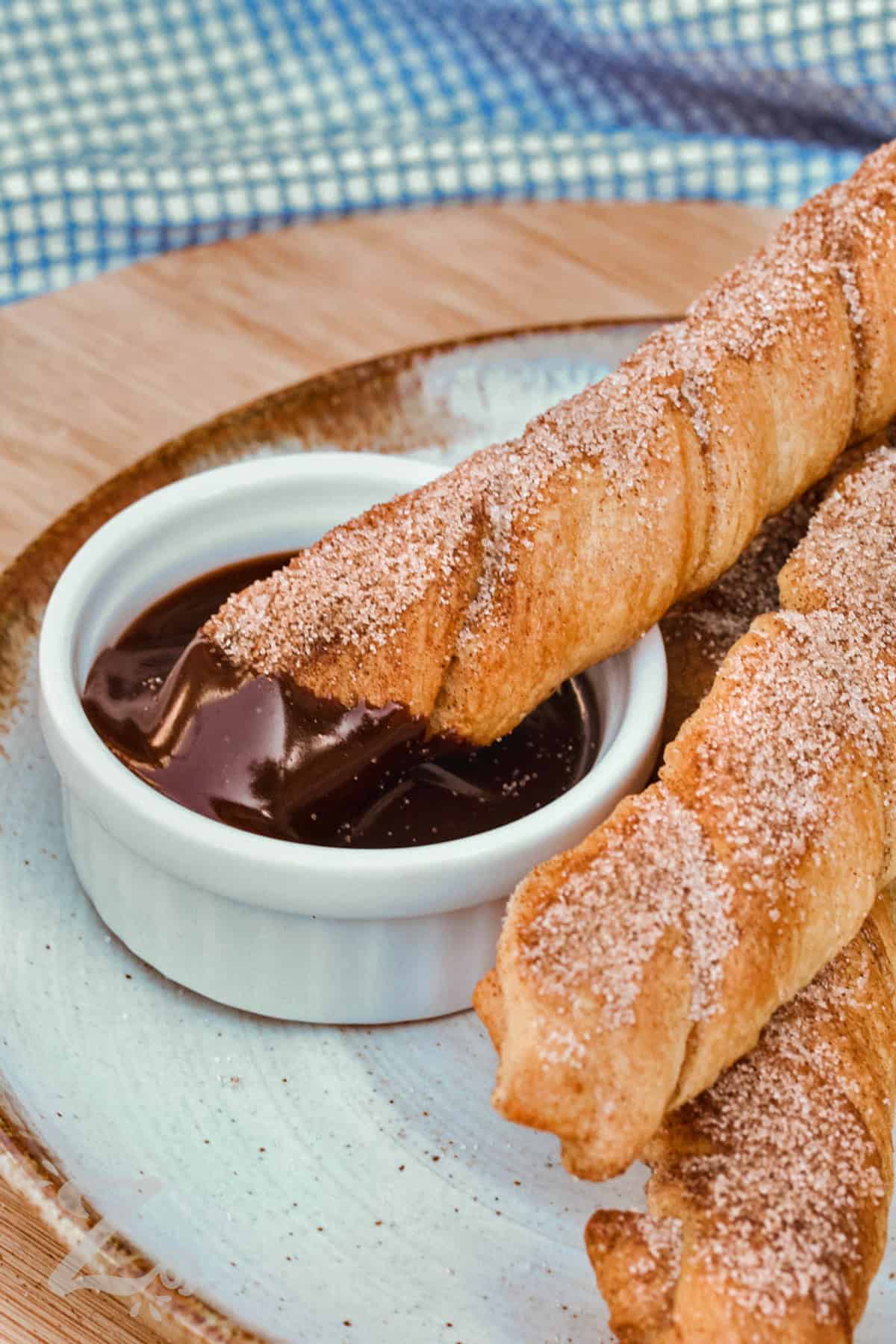 dipped Baked Churros in chocolate sauce