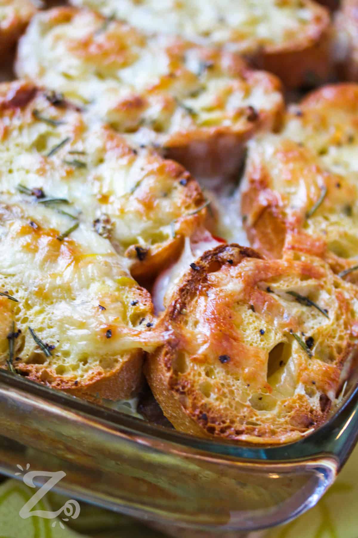 Breakfast strata with sausage baked in a glass casserole dish