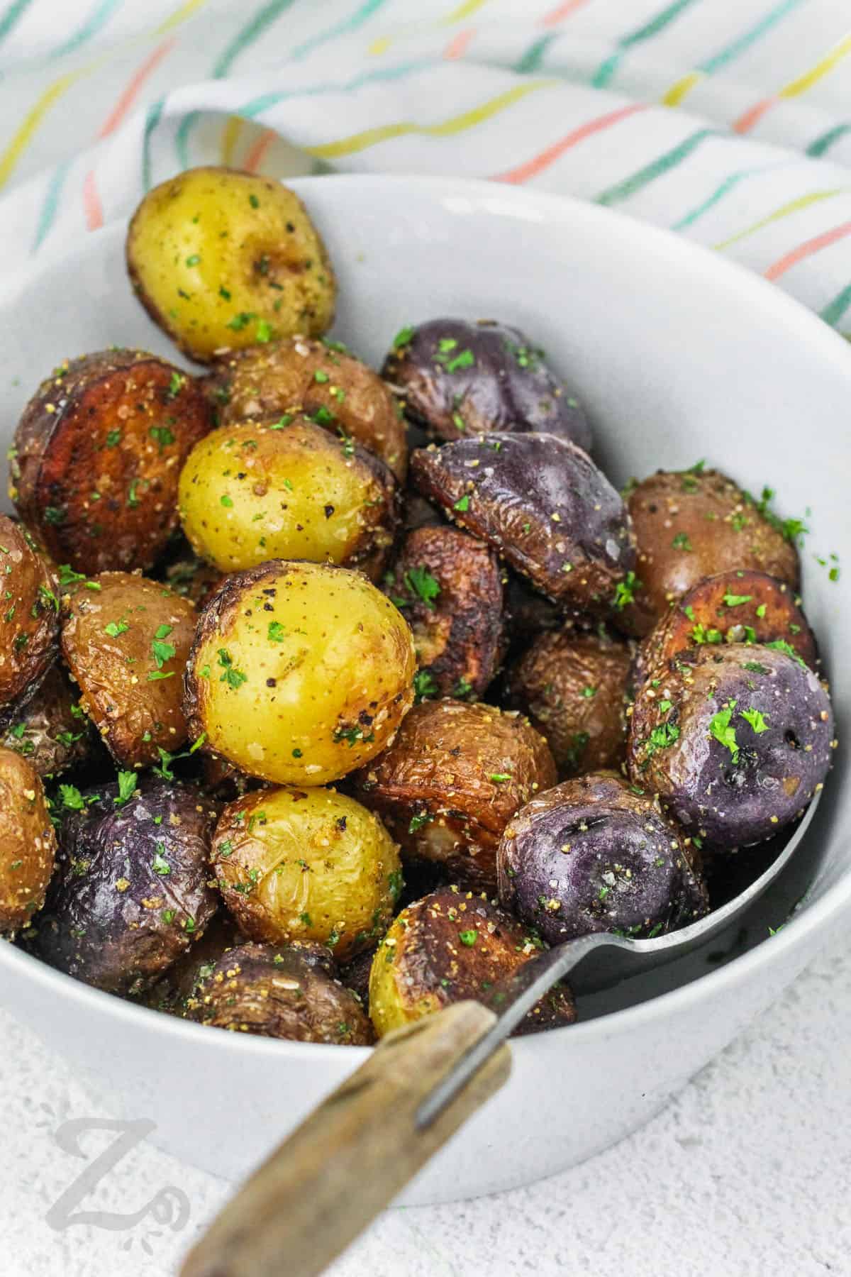 bowl of Fried Potatoes with a spoon