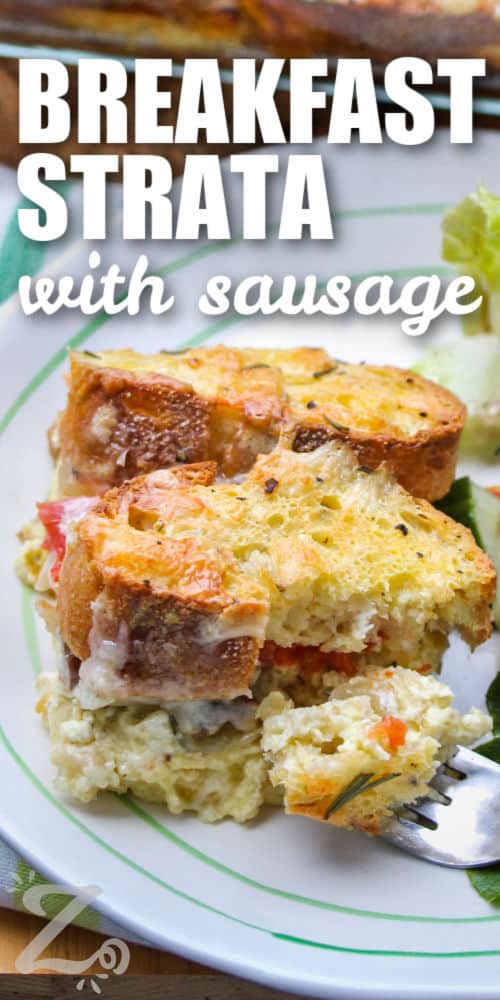 Breakfast strata with a fork full of strata on a plate with a tossed salad on the side, with a title.