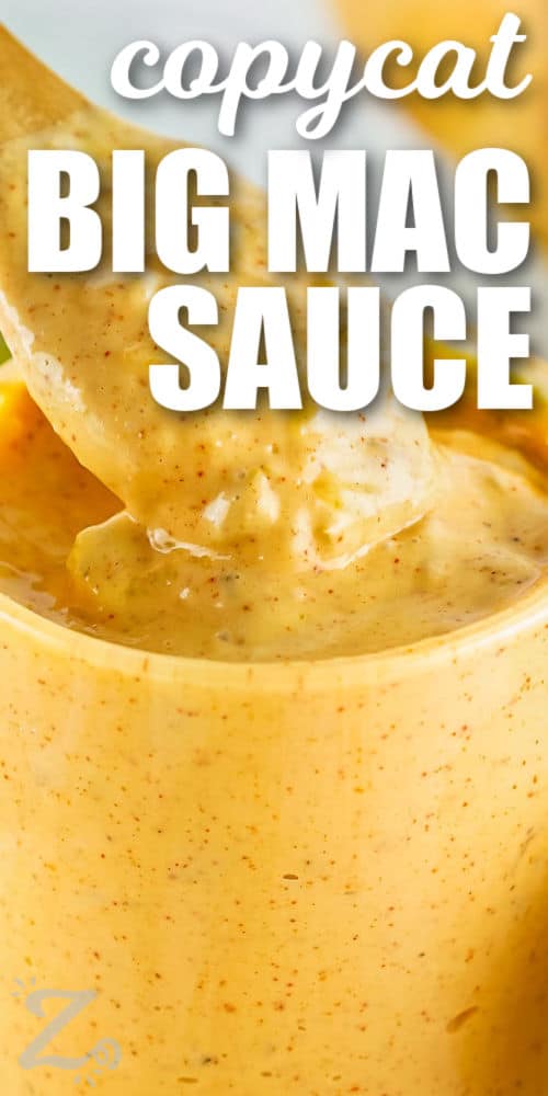 taking a spoonful of Copycat Big Mac Sauce with writing