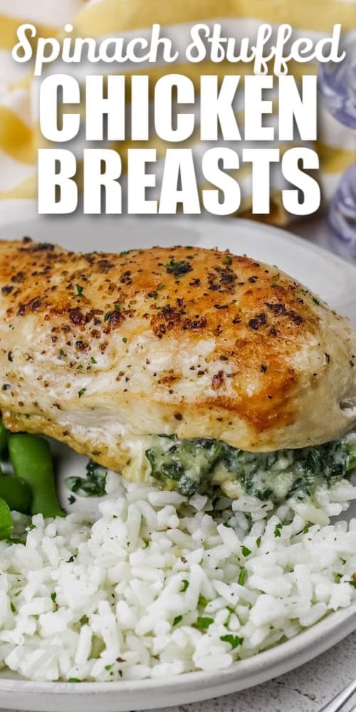Spinach Stuffed Chicken Breasts on a plate with rice and a title