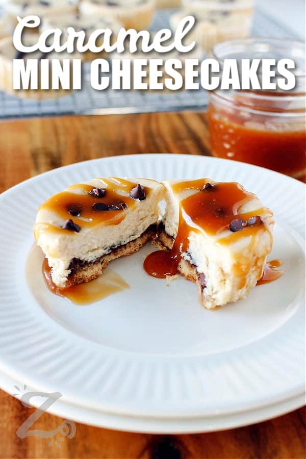 one of the caramel mini cheesecakes sliced in half on a white plate with caramel sauce in the background, with a title