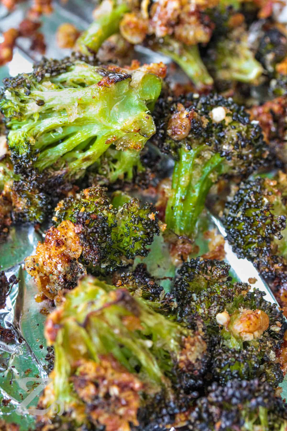 close up of Parmesan Roasted Broccoli on a sheet pan