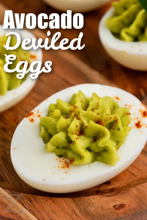 An avocado deviled egg with a title