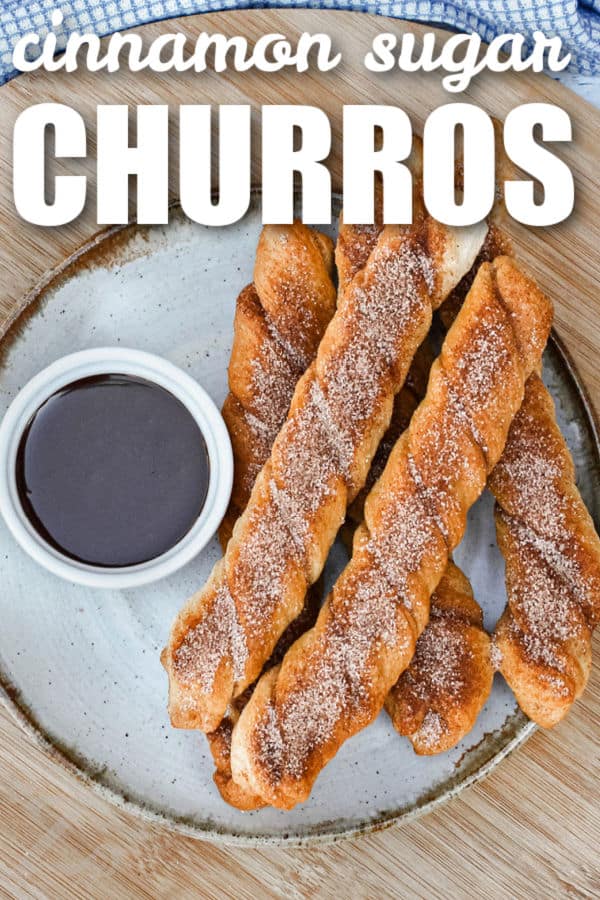 cinnamon sugar Baked Churros on a plate with chocolate and writing