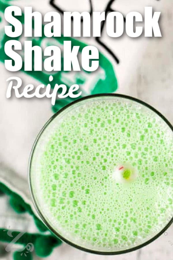 A homemade shamrock shake in a glass with text