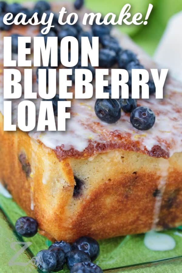 lemon blueberry loaf with glaze and fresh blueberries on top, with a title