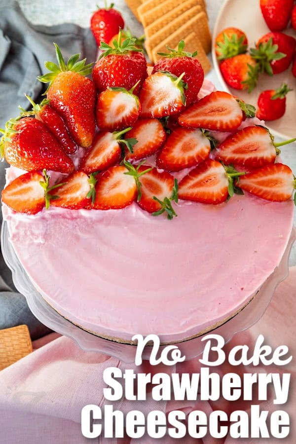 no bake strawberry cheesecake topped with sliced strawberries with a title