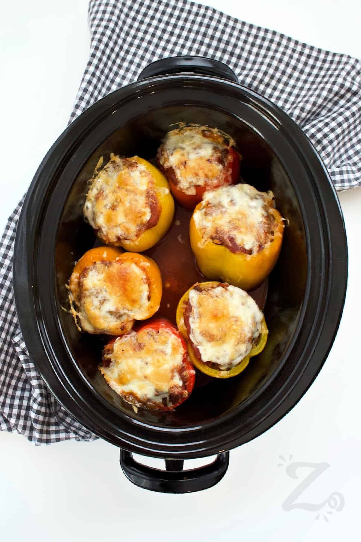 cooked slow cooker stuffed peppers in a Crock pot