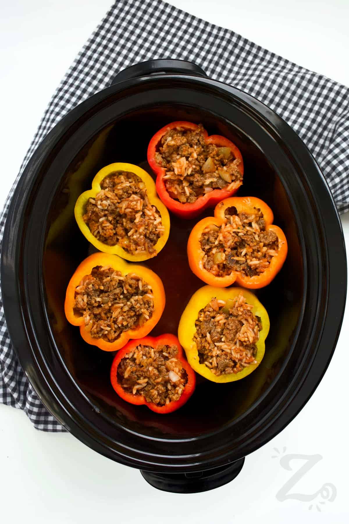 bell peppers stuffed with filling in a Crock pot to make slow cooker stuffed peppers