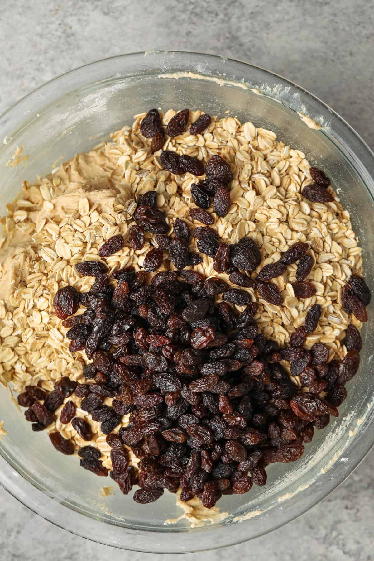 adding raisins to oats to make Oatmeal Raisin Cookies