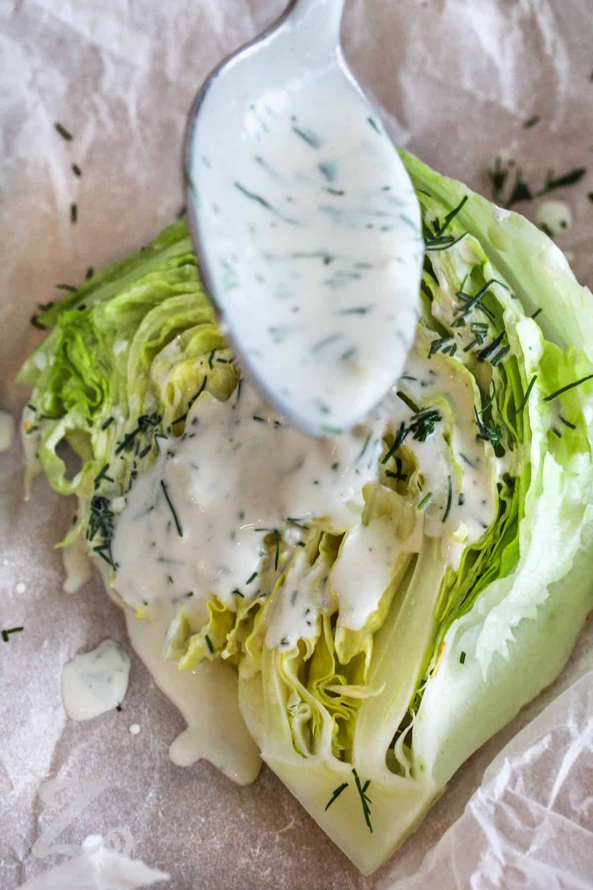 adding Dill Dressing to lettuce