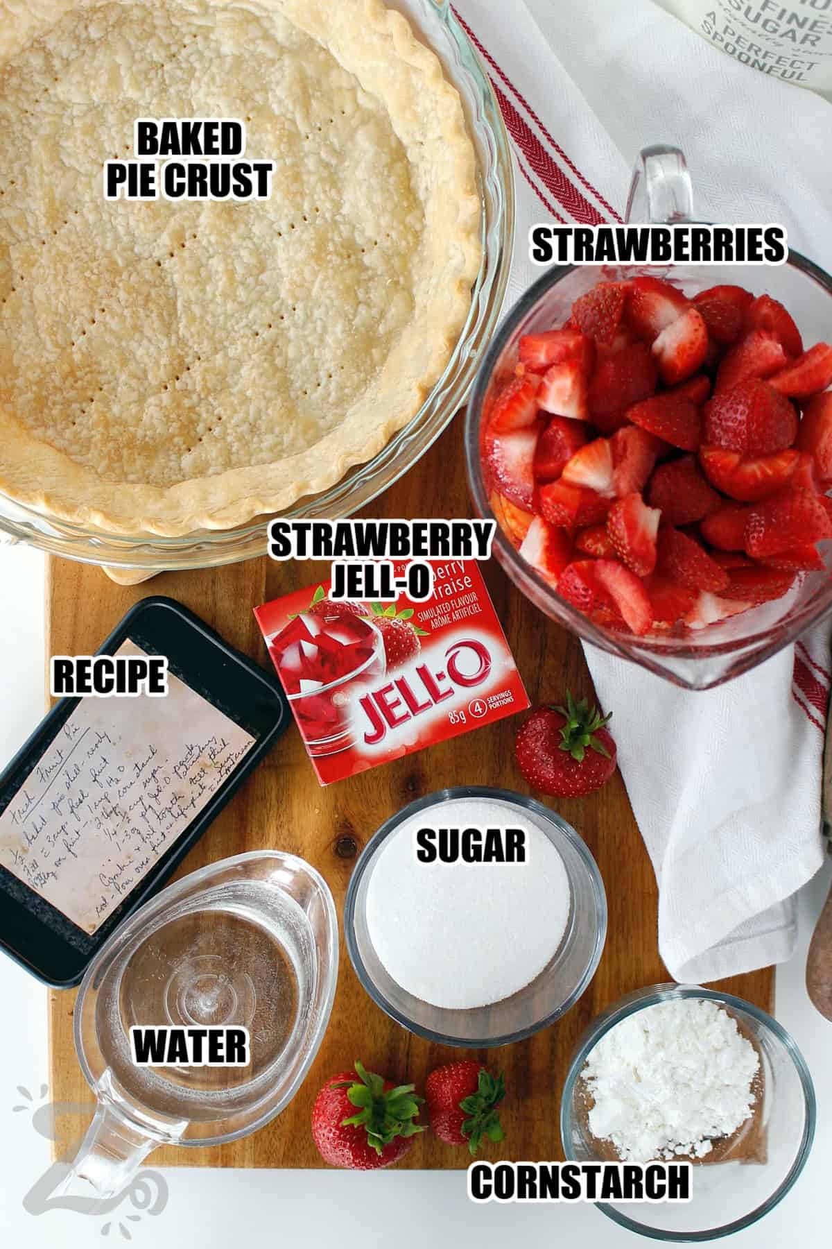 Strawberries, cornstarch, sugar, water, strawberry Jell-o, baked pie crust and the recipe assembled to make Fresh Strawberry Pie