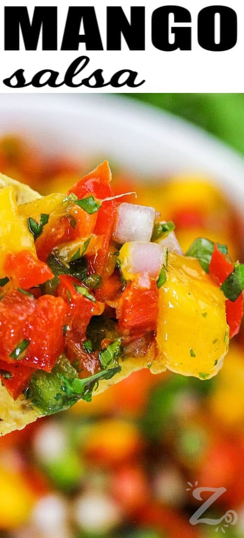 close up of Mango Salsa on a tortilla chip with a title