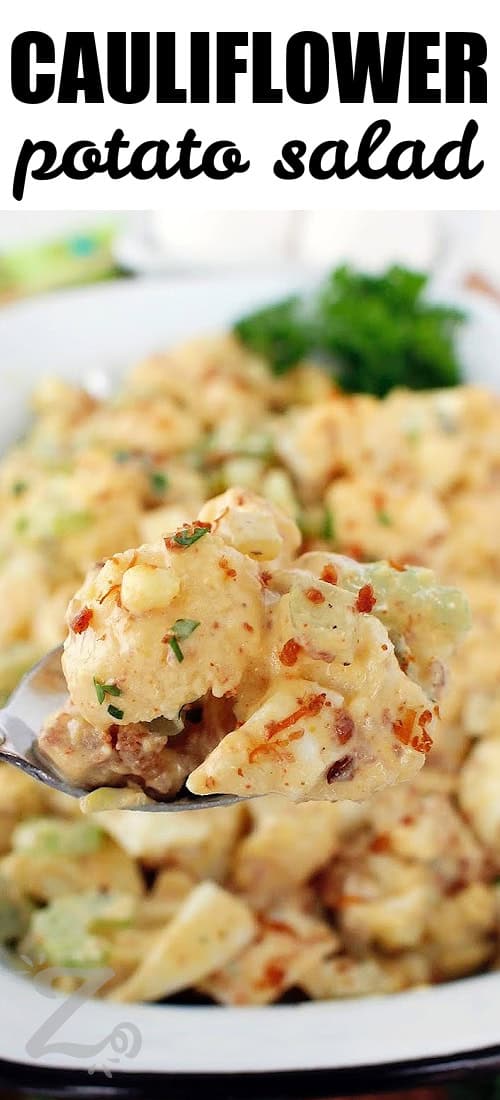 a close up of a spoonful of cauliflower potato salad with a title