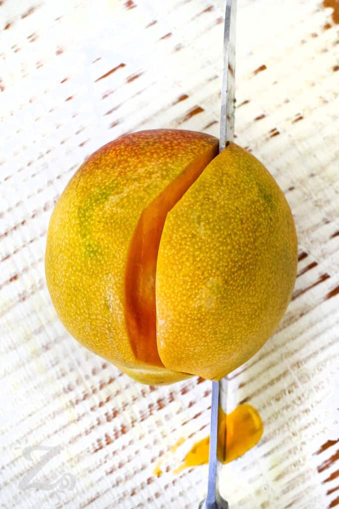 slicing a mango to make Mango Salsa