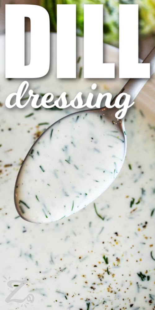 creamy Dill Dressing on a spoon with writing