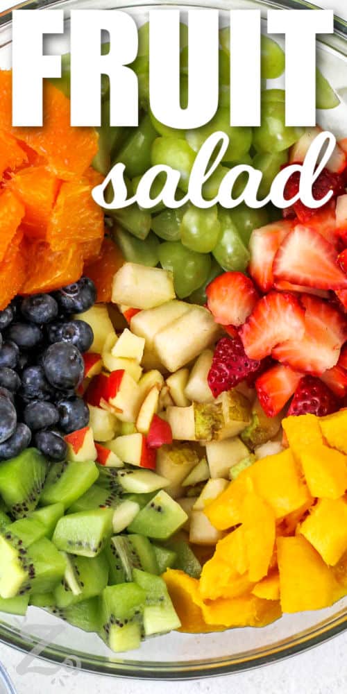 fruit in a clear bowl to make this delish recipe for fruit salad, with a title