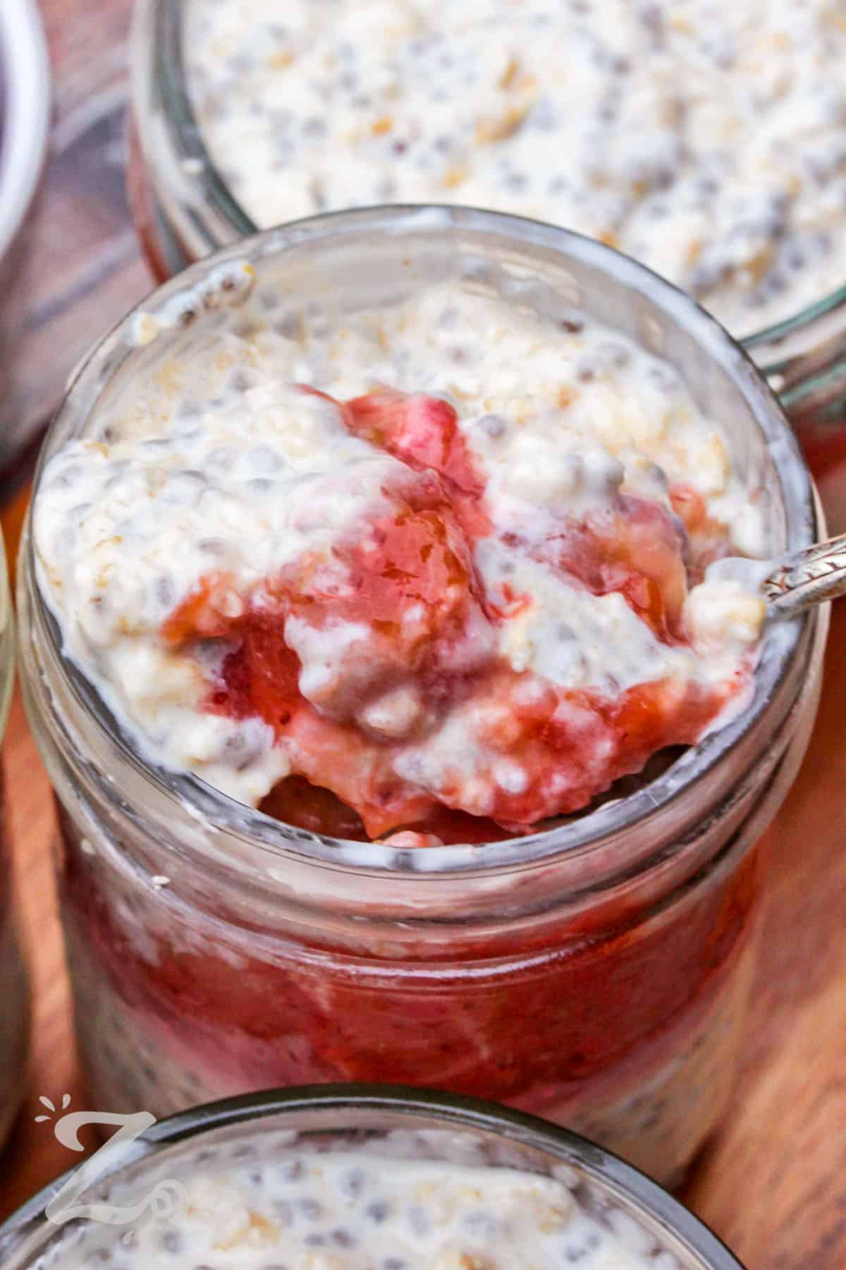 close up of Overnight Oats on a spoon and in a jar