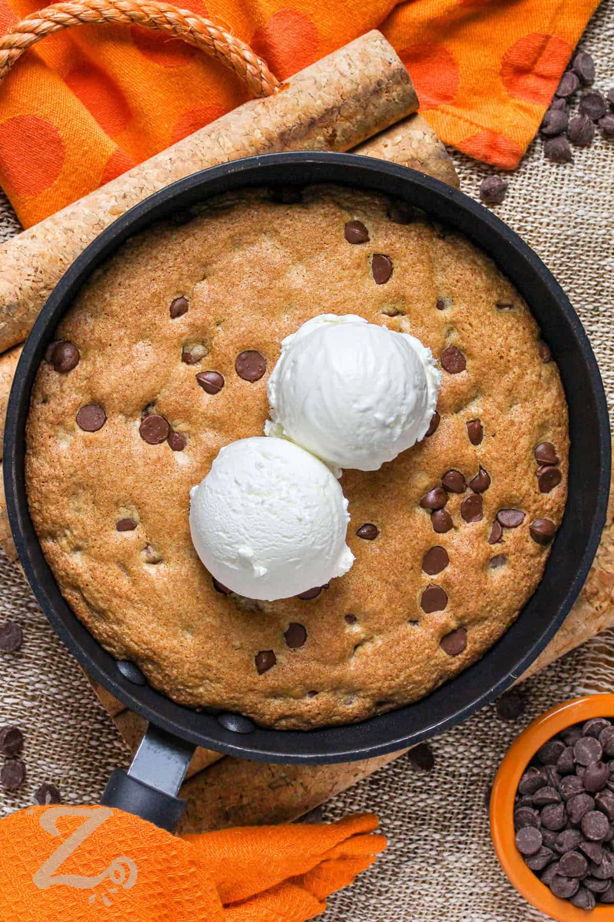 Pizookie in the pan with ice cream scoops on top