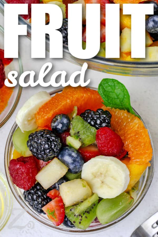 a clear bowl holds a single serving of an easy recipe for fruit salad, with a title