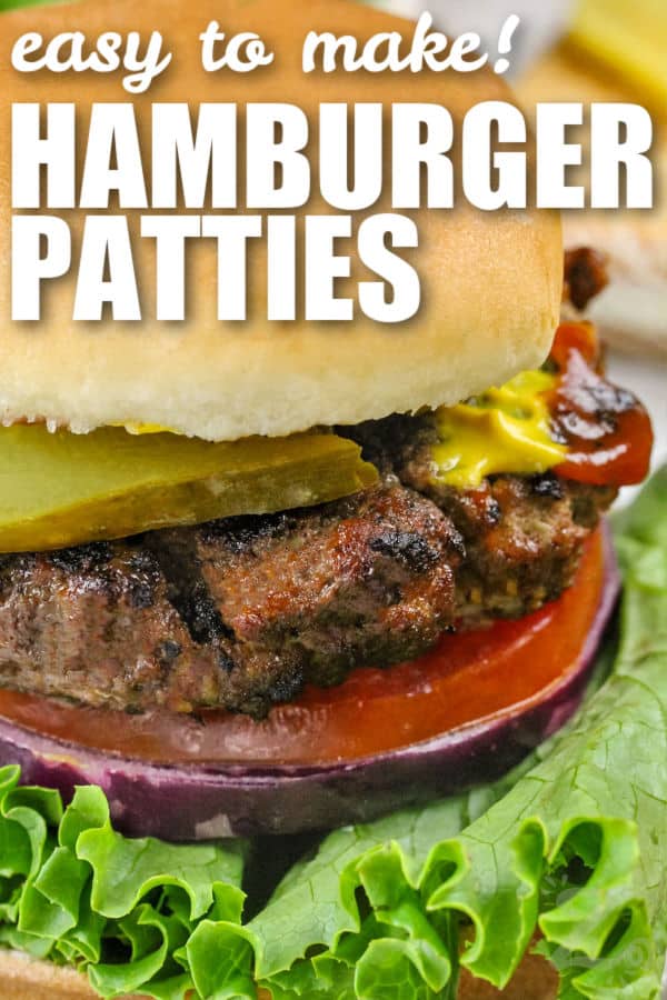 Hamburger Patties in a hamburger bun with toppings and writing