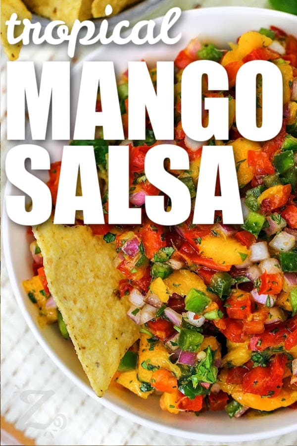 tropical Mango Salsa in a bowl with writing