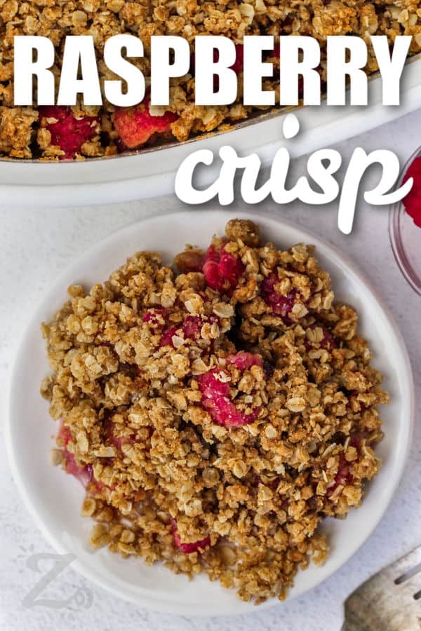 a serving of raspberry crisp on a small white plate, with a title