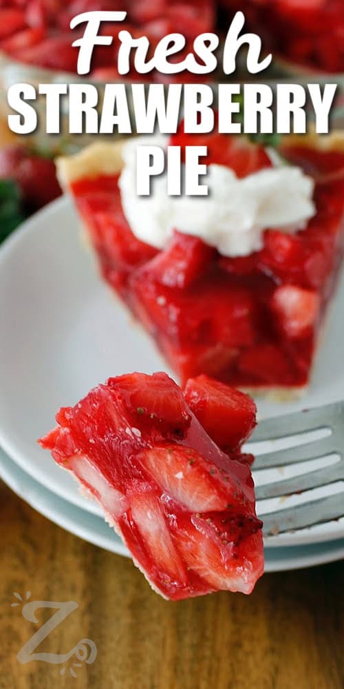 fresh strawberry pie on a fork, with a title