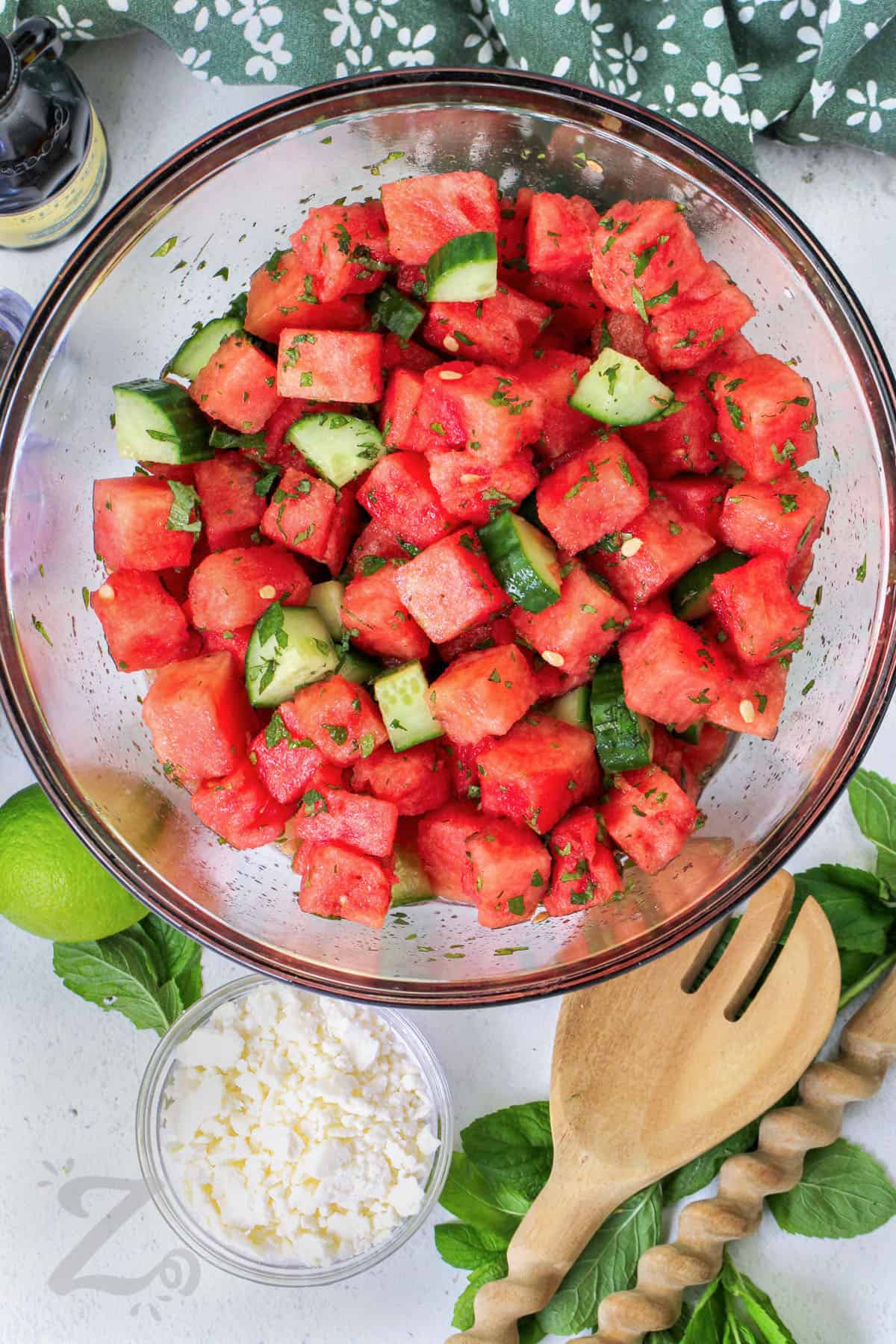 adding cucumber and watermelon together to make Watermelon Salad