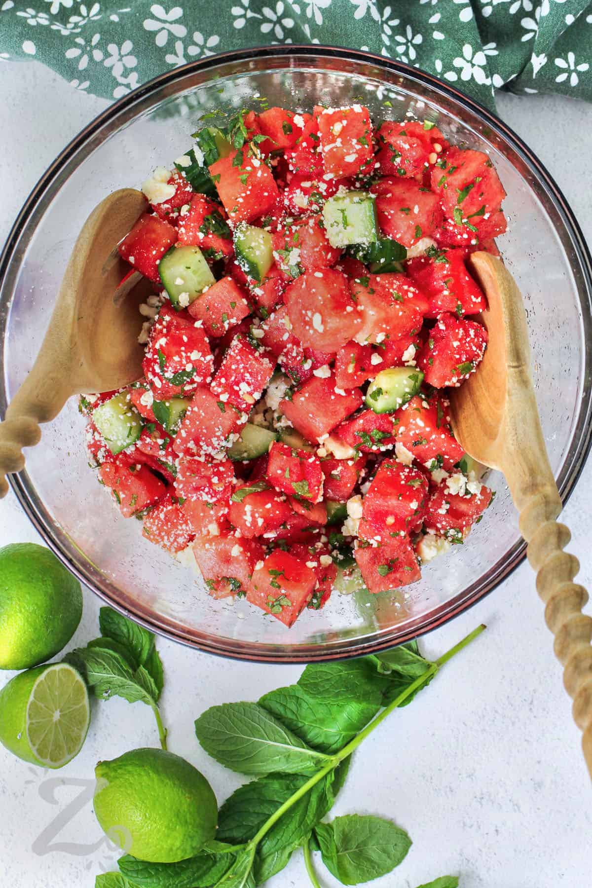 Watermelon Salad in a bowl with wooden spoons