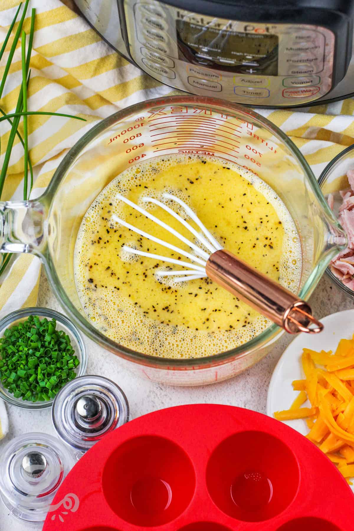 mixing eggs with seasonings to make Instant Pot Egg Bites