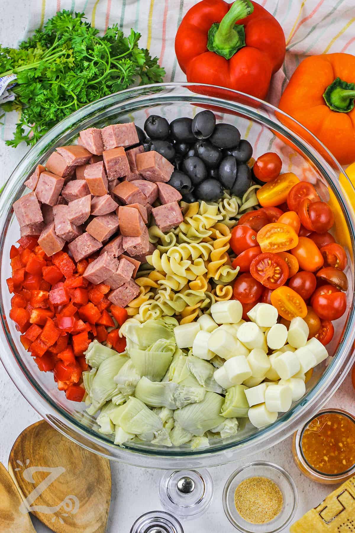 ingredients in a bowl to make Italian Pasta Salad