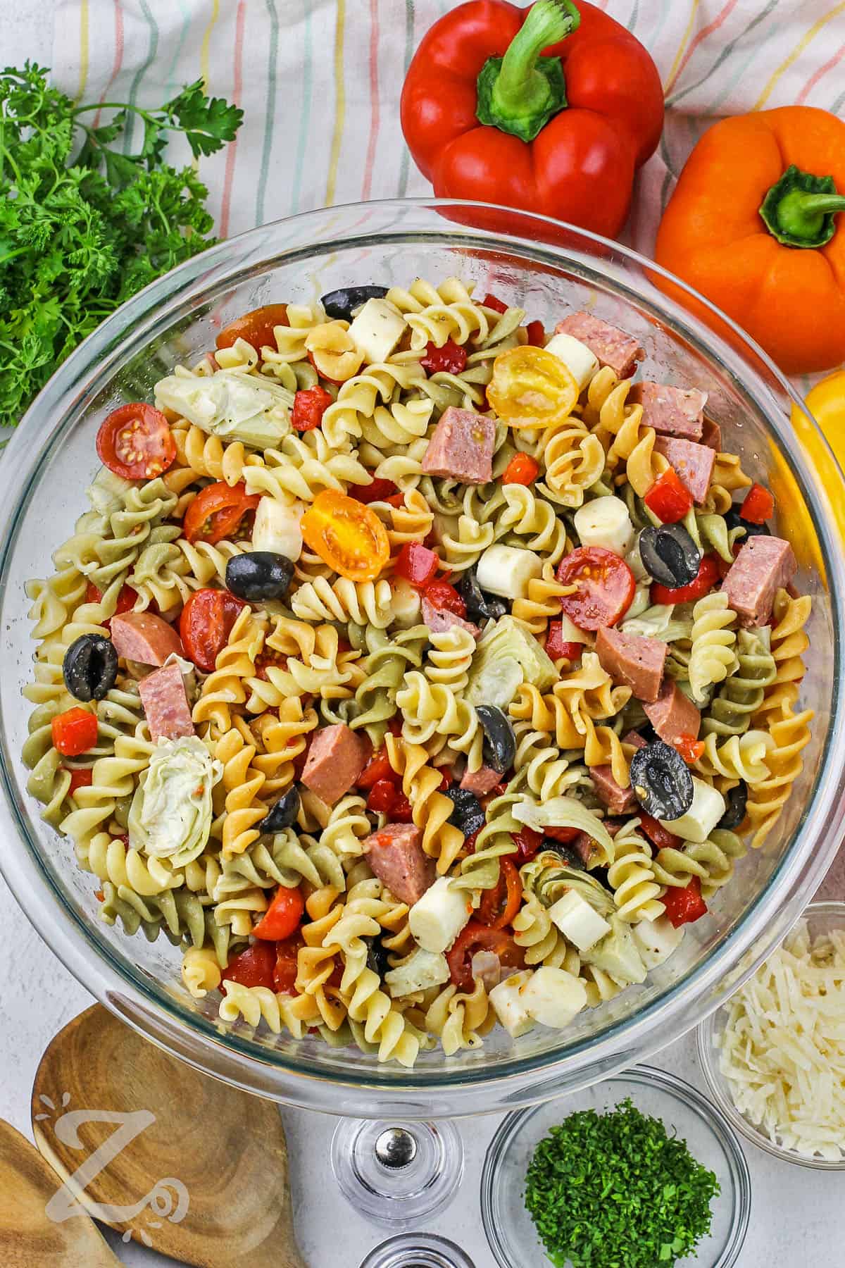 mixed ingredients to make Italian Pasta Salad