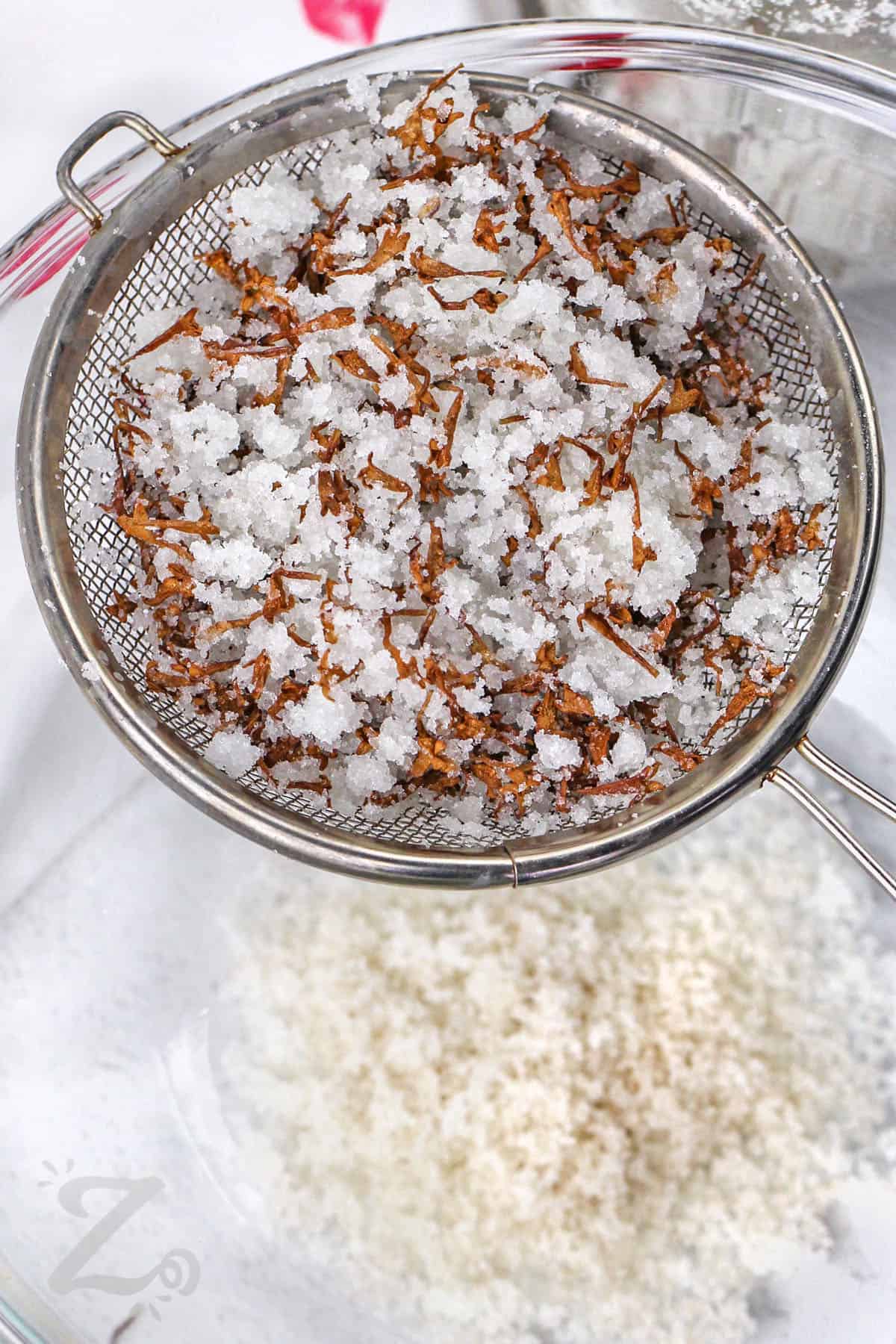 straining Lilac Sugar to get lilac pieces out