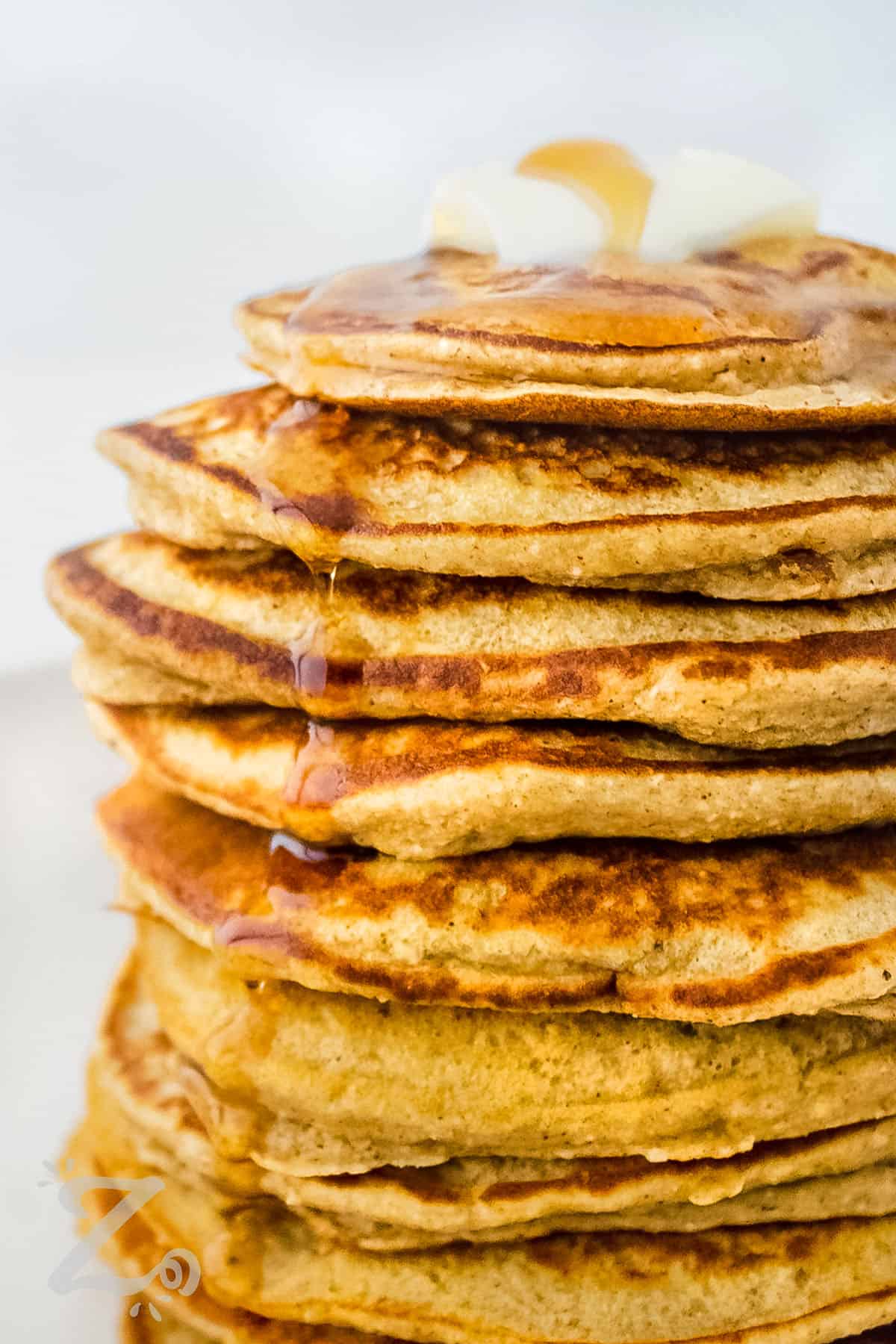 close up of Banana Oat Pancakes with syrup