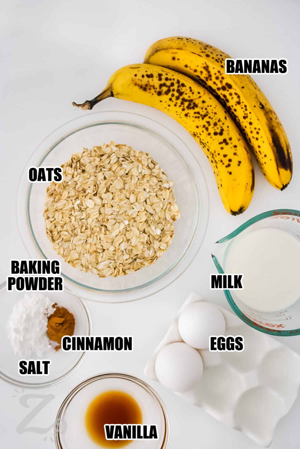 bananas , oats , baking powder , cinnamon , salt , vanilla , eggs , milk with labels to make Banana Oat Pancakes