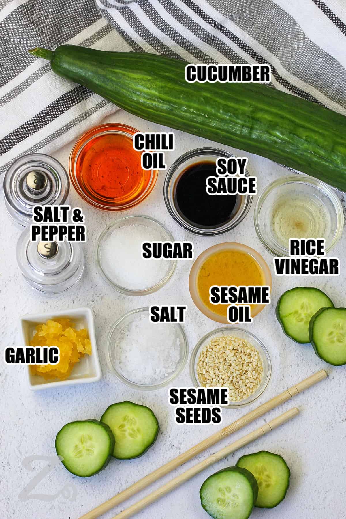 cucumber , soy sauce , chili oil , soy sauce , rice vinegar , sugar , sesame oil , sesame seeds , garlic , salt and pepper with labels to make Korean Cucumber Salad Recipe