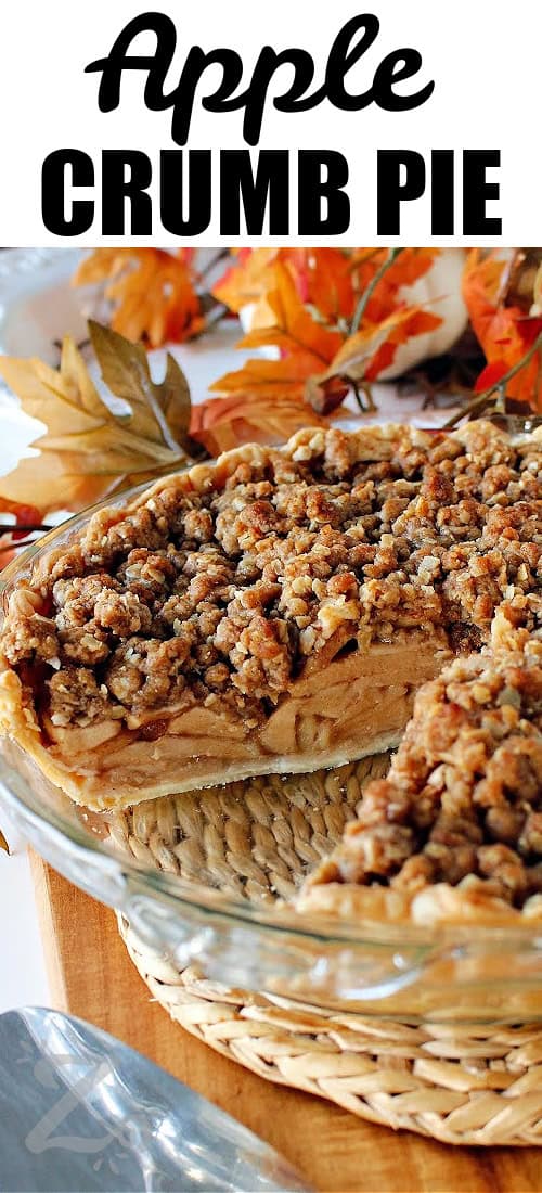 baked apple crumb pie in a clear pie plate with a slice taken out with a title