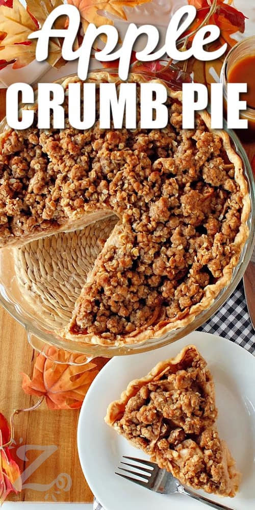 baked apple crumb pie with a slice taken out and served on a white plate, with a title